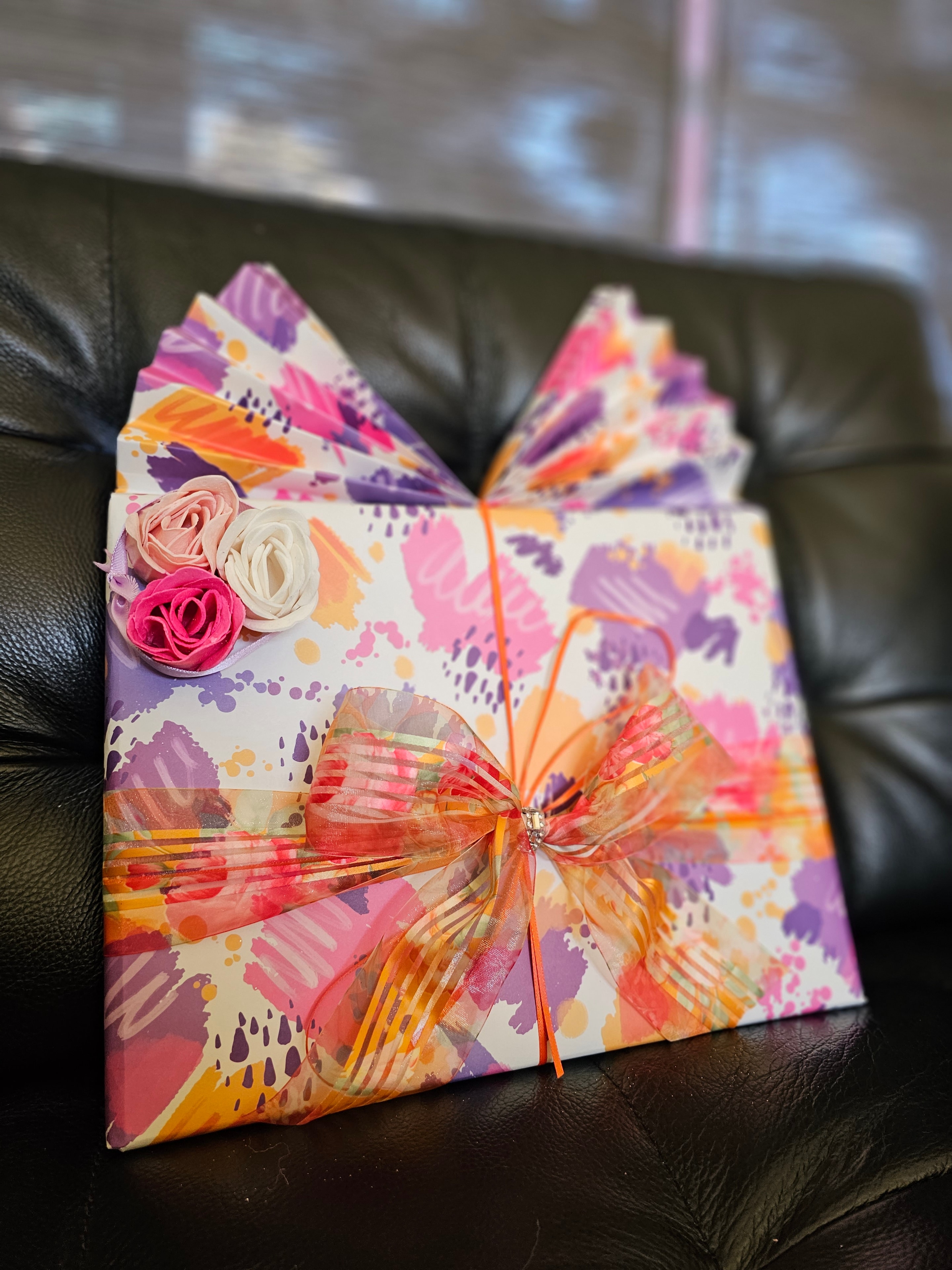 Stacked elegant gift boxes with wrapping paper texture