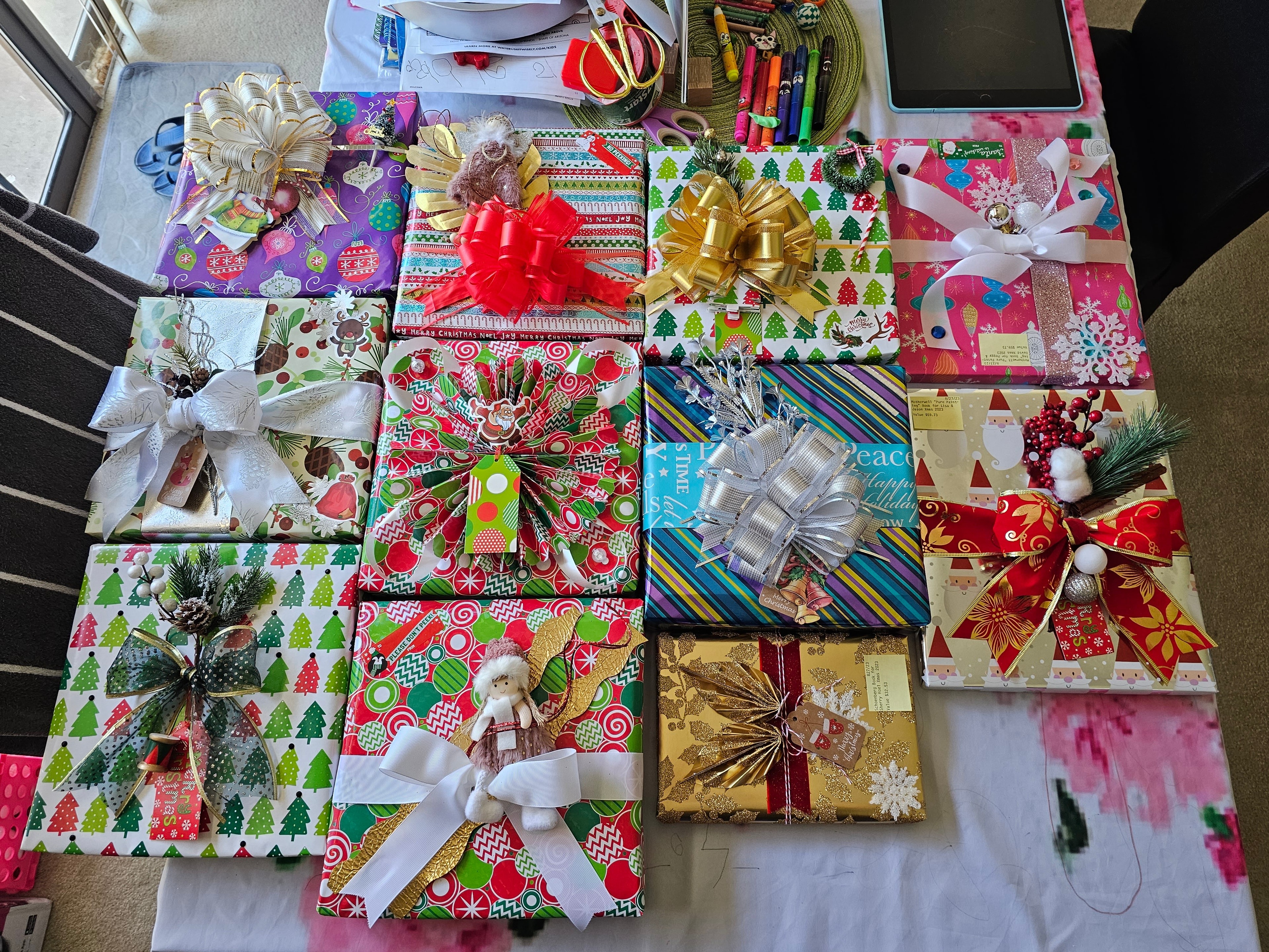 Hands tying ribbon on artisan wrapped gift