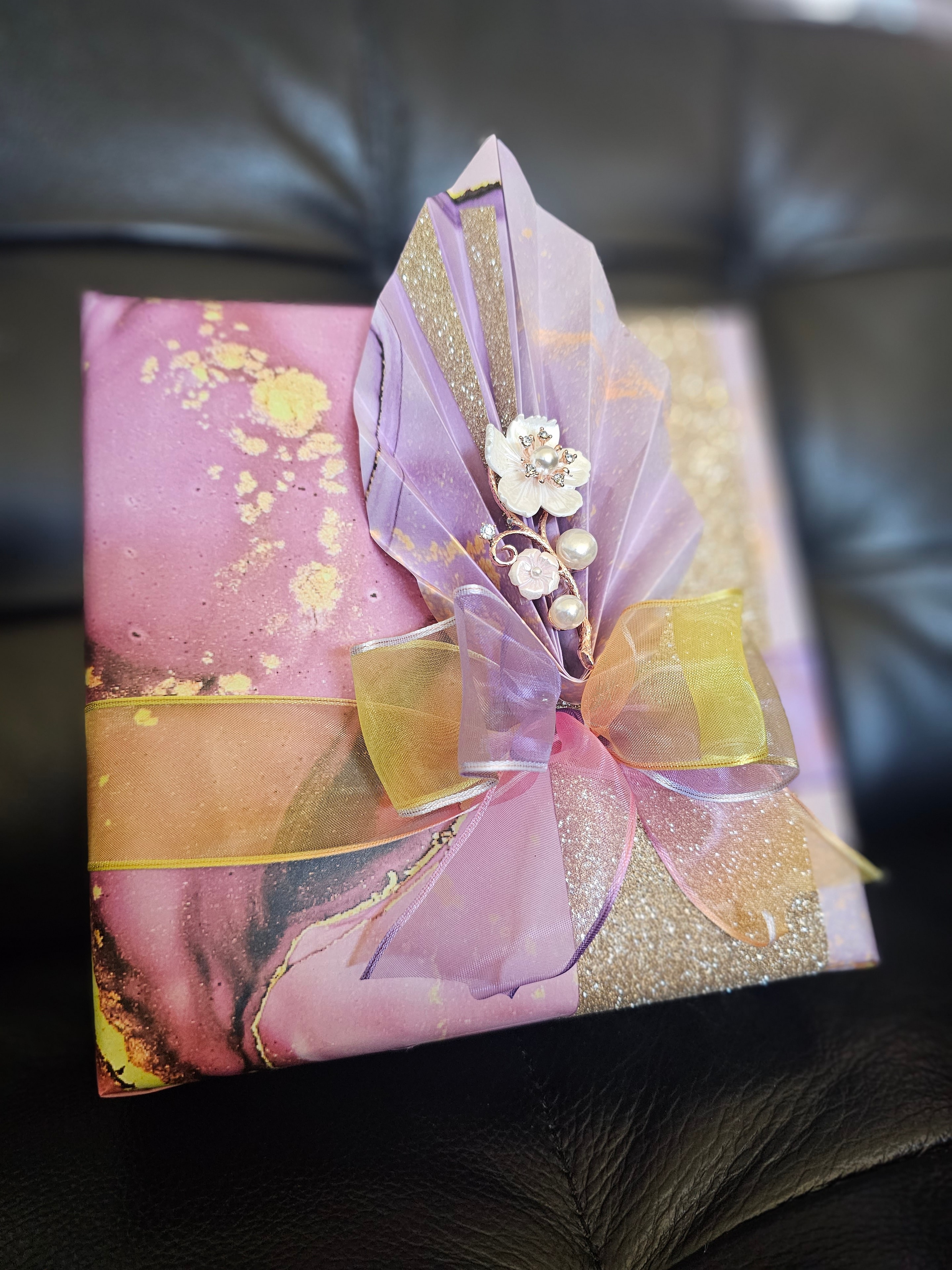 Elegantly wrapped personal gift with ribbon